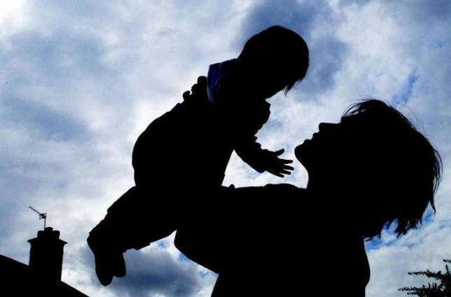 an unidentified mother and her baby play at home in london in this photo taken on april 26 2001 photo reuters