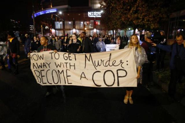 protesters march through uptown charlotte north carolina november 30 2016 following the decision of the district attorney not to press criminal charges against police in the shooting of keith scott photo reuters