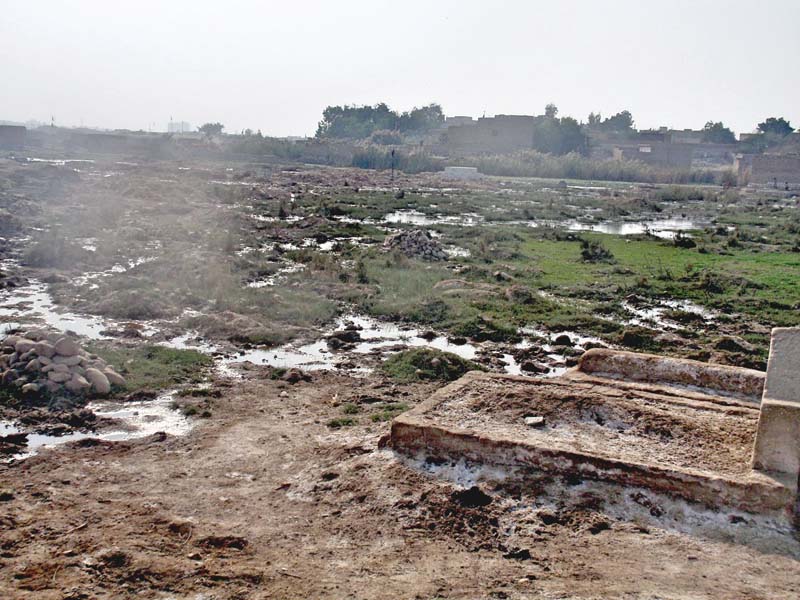 a view of the pir murad shah graveyard inundated with sewerage water photo express