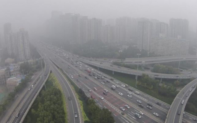 vehicles drive along the residential buildings on beijing 039 s fourth ring road october 11 2014 reuters jason lee vehicles drive along the residential buildings on beijing 039 s fourth ring road october 11 2014 reuters jason lee