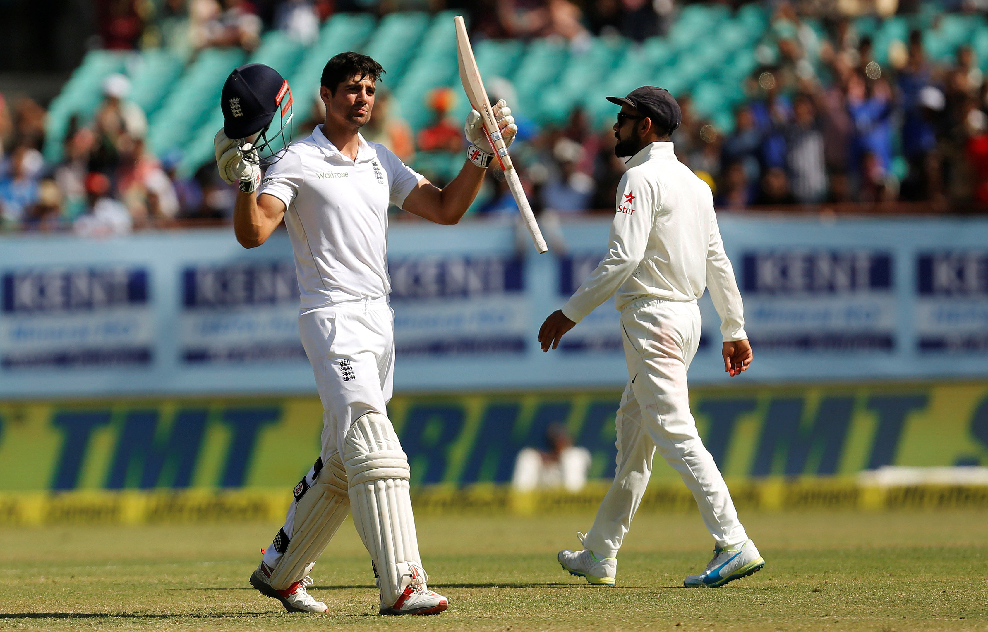 alastair cook celebrates his century as virat kohli r looks on photo reuters amit dave