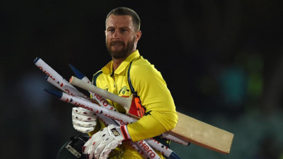 australia coach looks to defuse maxwell wade row