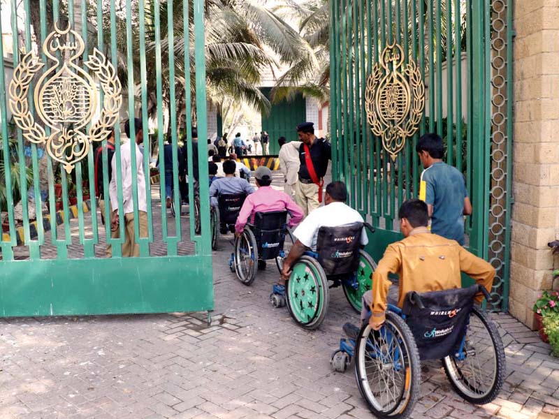 differently abled people entering the cm house to meet chief minister murad ali shah on international day of people with disabilities photo online