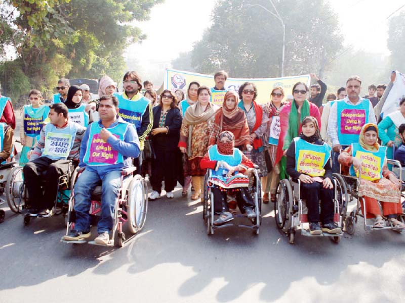 a rally held to raise awareness on the international day of disabled persons photo abid nawaz express