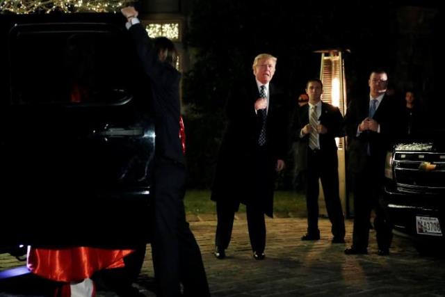 u s president elect donald trump points to himself when asked who he is dressed as as he arrives at a costume party at the home of hedge fund billionaire and campaign donor robert mercer in head of the harbor new york us december 3 2016 photo reuters