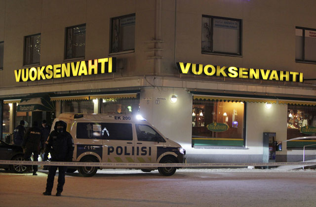 police guards the area were three people were killed in a shooting incident at a restaurant in imatra eastern finland after midnight on december 4 2016 photo afp