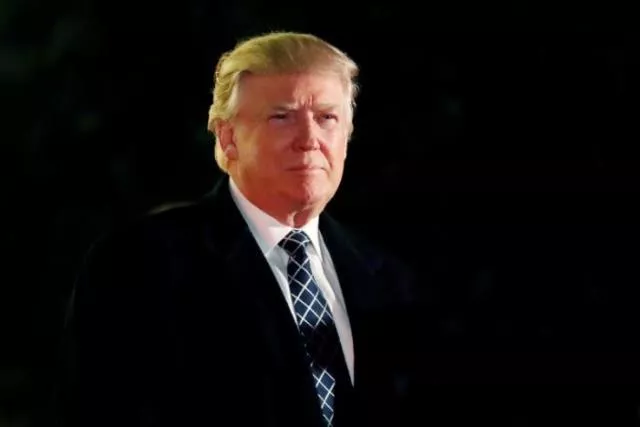 u s president elect donald trump looks towards the media as he arrives at a costume party at the home of hedge fund billionaire and campaign donor robert mercer in head of the harbor new york us december 3 2016 photo reuters u s president elect donald trump looks towards the media as he arrives at a costume party at the home of hedge fund billionaire and campaign donor robert mercer in head of the harbor new york us december 3 2016 photo reuters