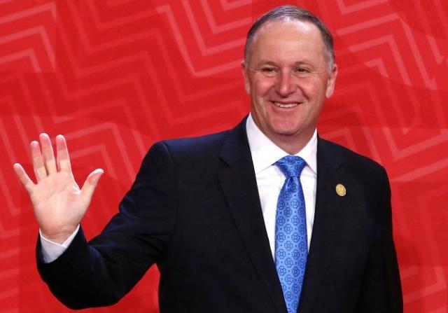 new zealand 039 s prime minister john key waves to photographers during the apec asia pacific economic cooperation summit in lima peru november 20 2016 photo reuters