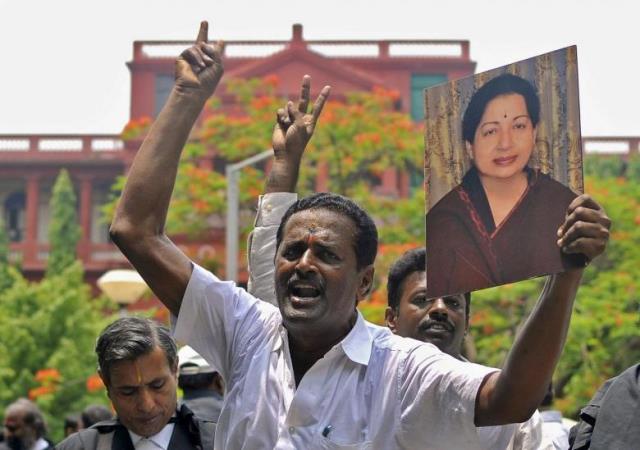 lawyers from the karnataka high court hold a portrait of jayalalithaa jayaram chief minister of tamil nadu and chief of her aiadmk party during celebrations outside a court in bengaluru india may 11 2015 photo reuters