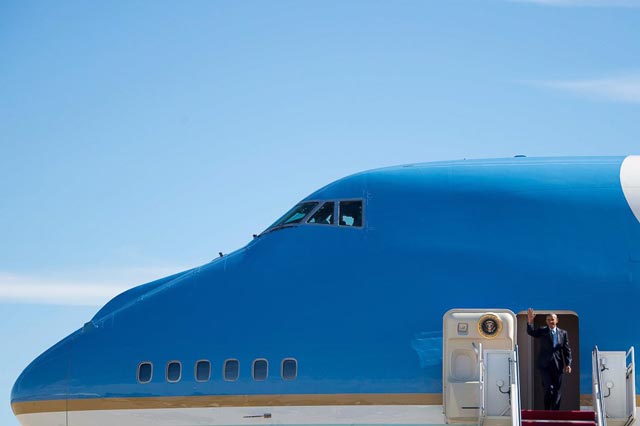 us president barack obama waves as he walks off air force one in greensboro north carolina photo afp