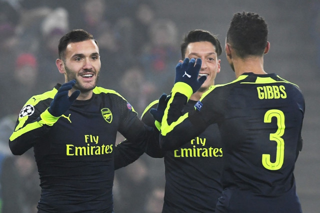 lucas perez l celebrates with mesut ozil 2r and kieran gibbs after scoring a goal on december 6 2016 at the st jakob park stadium in basel photo afp lucas perez l celebrates with mesut ozil 2r and kieran gibbs after scoring a goal on december 6 2016 at the st jakob park stadium in basel photo afp