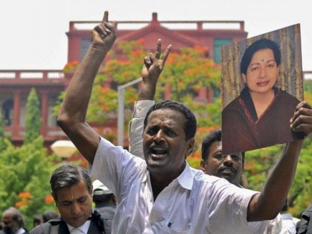 lawyers from the karnataka high court hold a portrait of jayalalithaa jayaram chief minister of tamil nadu and chief of her aiadmk party during celebrations outside a court in bengaluru india may 11 2015 photo reuters lawyers from the karnataka high court hold a portrait of jayalalithaa jayaram chief minister of tamil nadu and chief of her aiadmk party during celebrations outside a court in bengaluru india may 11 2015 photo reuters