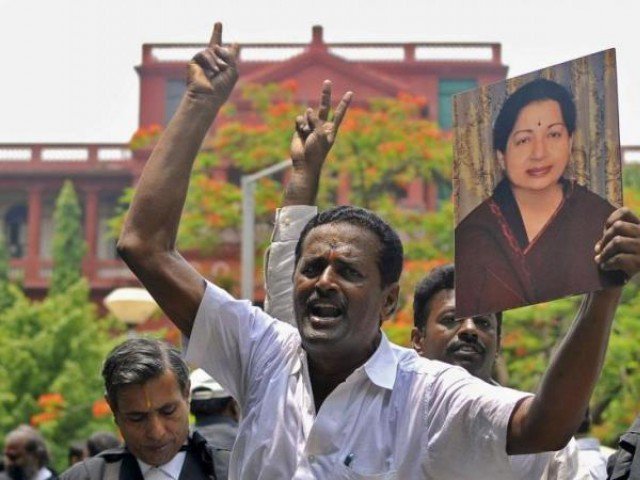 lawyers from the karnataka high court hold a portrait of jayalalithaa jayaram chief minister of tamil nadu and chief of her aiadmk party during celebrations outside a court in bengaluru india may 11 2015 photo reuters