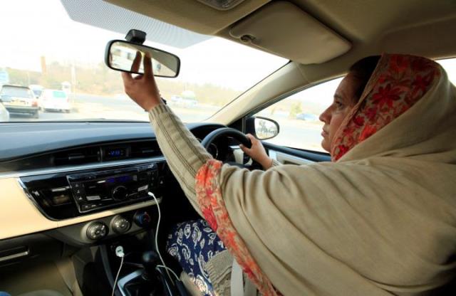 yasmin perveen one of the pioneer women 039 captains 039 of careem adjusts back mirror while driving her car in islamabad pakistan december 7 2016 photo reuters