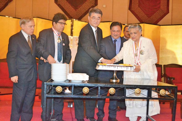 consul general of japan in karachi toshikazu isomura cuts a huge vanilla cr me coloured cake with architect yasmin lari at a ceremony to celebrate the japanese emperor s birthday photo courtesy japanese consulate consul general of japan in karachi toshikazu isomura cuts a huge vanilla cr me coloured cake with architect yasmin lari at a ceremony to celebrate the japanese emperor s birthday photo courtesy japanese consulate