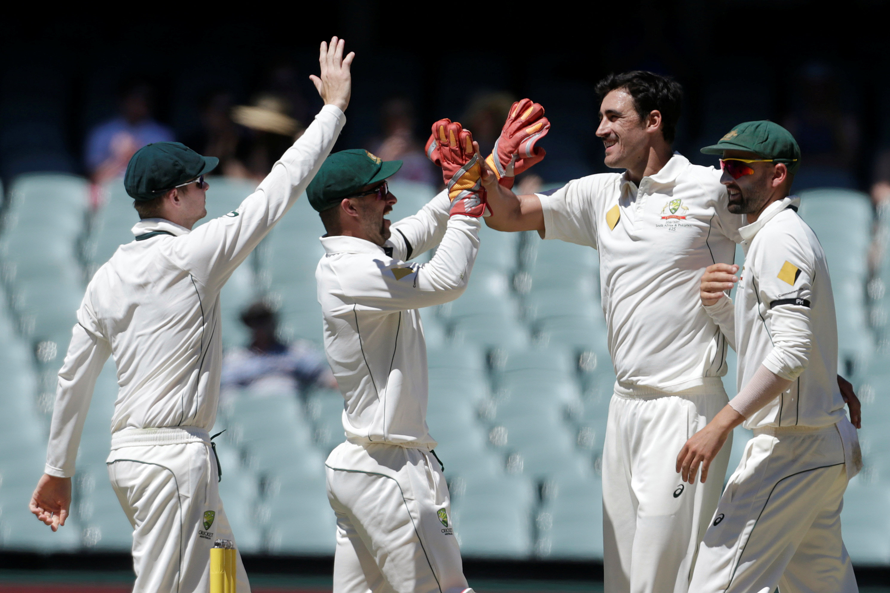 mitchell starc 2r celebrates teammates during third test against south africa in adelaide photo reuters jason reed