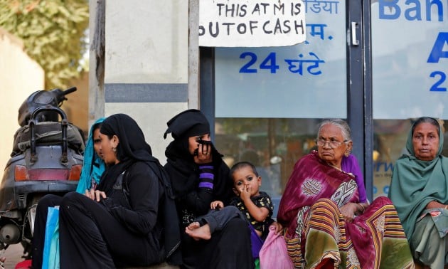 women sit outside a bank in ahmedabad india november 29 2016 photo reuters