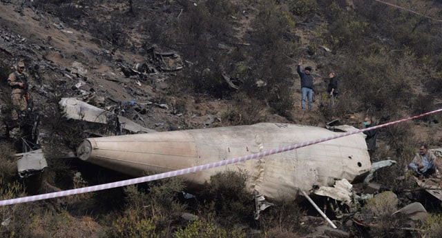 investigators scan the wreckage of the crashed pia passenger plane flight pk661 at the crash site near the village of saddha batolni in the abbottabad district of khyber pakhtunkhwa on december 8 2016 photo afp investigators scan the wreckage of the crashed pia passenger plane flight pk661 at the crash site near the village of saddha batolni in the abbottabad district of khyber pakhtunkhwa on december 8 2016 photo afp