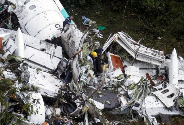 rescue crews work in the wreckage from a plane that crashed into colombian jungle with brazilian soccer team chapecoense onboard near medellin colombia november 29 2016 photo reuters