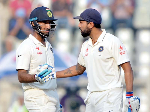 vijay and pujara put on the highest partnership of the test so far with 107 to help india finish on 146 1 at stumps photo afp