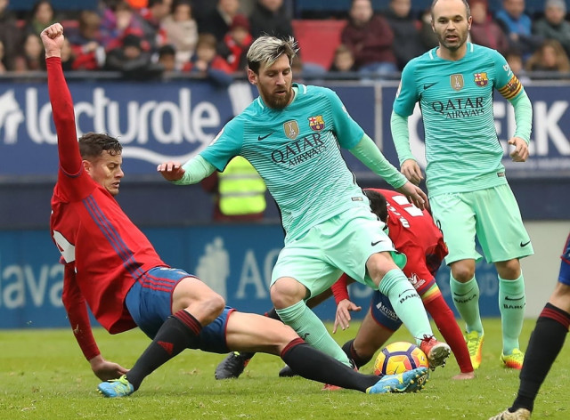 messi scored twice as barcelona kept pace with la liga leaders real madrid with a 3 0 win over osasuna photo afp messi scored twice as barcelona kept pace with la liga leaders real madrid with a 3 0 win over osasuna photo afp
