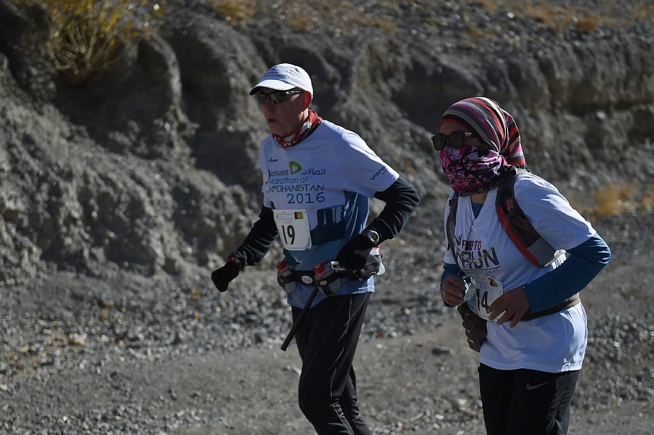 afghan and international marathon runners taking part in a marathon photo afp