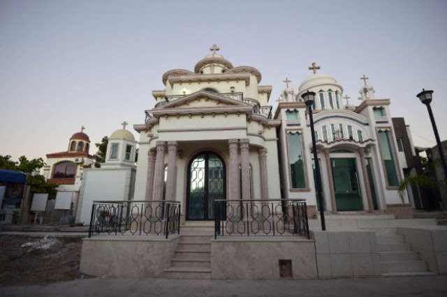 view of elaborate tombs in the jardines del humaya cemetery in culiacan sinaloa state in northwest mexico on december 7 2016 on december 11 2016 mexico marked 10 years since the government began to deploy troops in a drug war that has killed tens of thousands of people with many victims buried unceremoniously in mass graves dumped on roadsides or left hanging on bridges but the drug barons of sinaloa state have given themselves more dignified final resting places two story tombs fitted with living rooms air conditioning and bulletproof glass photo afp