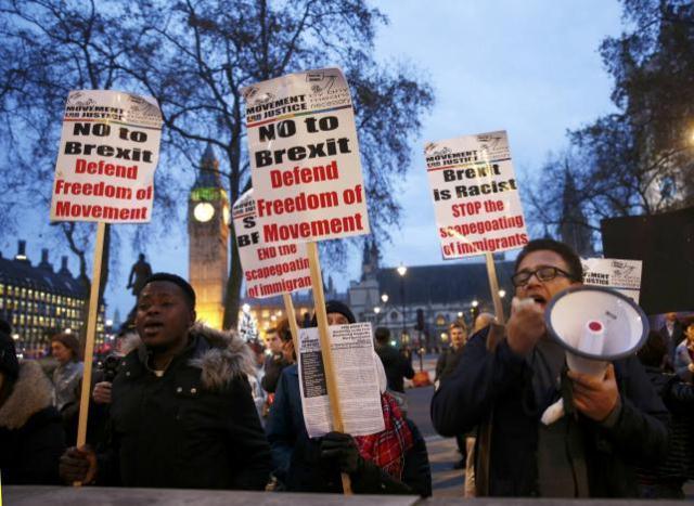 protesters shout slogans and hold placards outside supreme court after the third day of the challenge against a court ruling that theresa may 039 s government requires parliamentary approval to start the process of leaving the european union in parliament square central london britain december 7 2016 photo reuters