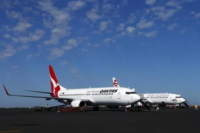 a qantas airlines boeing 737 plane sits next to a virgin australia boeing 737 plane photo reuters a qantas airlines boeing 737 plane sits next to a virgin australia boeing 737 plane photo reuters