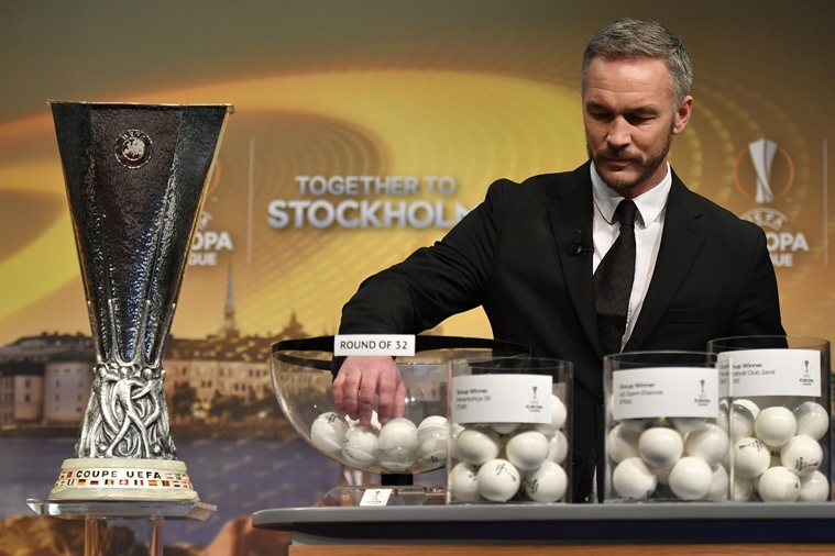 sweden 039 s former defender and 2017 europa league final ambassador patrik andersson holds the draw for the round of 32 of the uefa europa league football tournament at the uefa headquarters in nyon on december 12 2016 photo afp