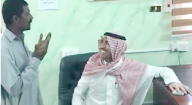 a relative of pakistani truck driver rustam khan raises his hands in supplication after saudi actor fayez al malki hands over blood money amount to him in this screenshot of a social media video clip