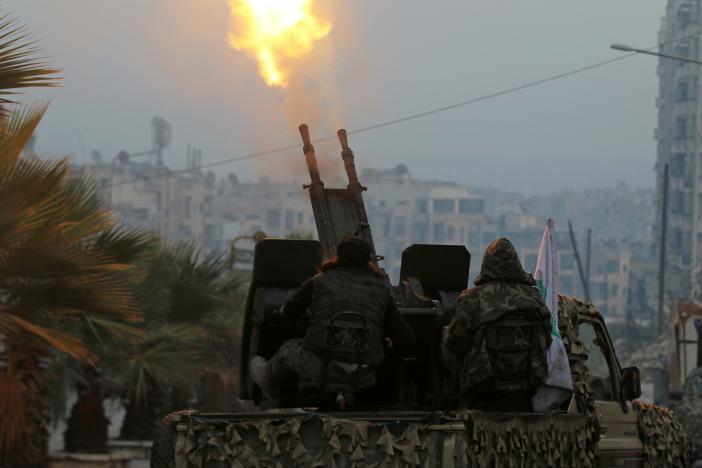 free syrian army fighters fire an anti aircraft weapon in a rebel held area of aleppo syria photo reuters