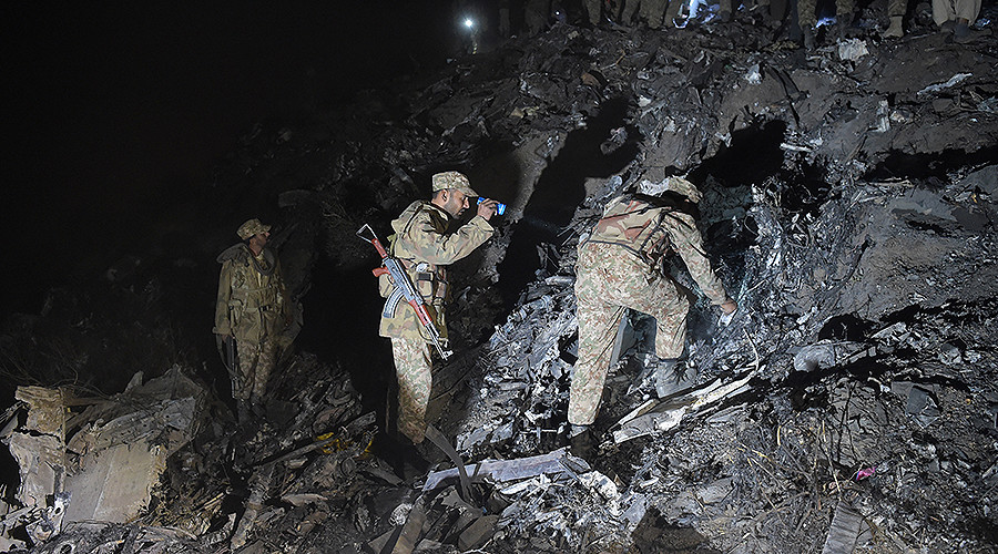 soldiers search for victims from the wreckage of the crashed pia passenger plane flight pk661 at the site near abbottabad on december 7 2016 photo afp