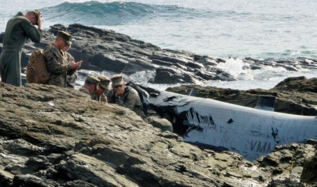 u s military personnel investigate the wreckage of a u s marine corps mv 22 osprey aircraft that crash landed in the sea off nago in nago okinawa prefecture japan in this photo taken by kyodo december 14 2016 photo reuters