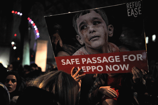 protesters hold placards during a demonstration in solidarity with the enhabitants of the embattled syrian city of aleppo outside the entrance to downing street in central london photo afp protesters hold placards during a demonstration in solidarity with the enhabitants of the embattled syrian city of aleppo outside the entrance to downing street in central london photo afp