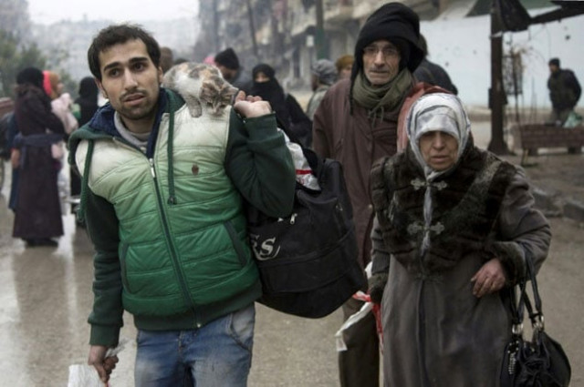 people leave a rebel held area of aleppo towards the government held side on december 13 2016 photo afp people leave a rebel held area of aleppo towards the government held side on december 13 2016 photo afp