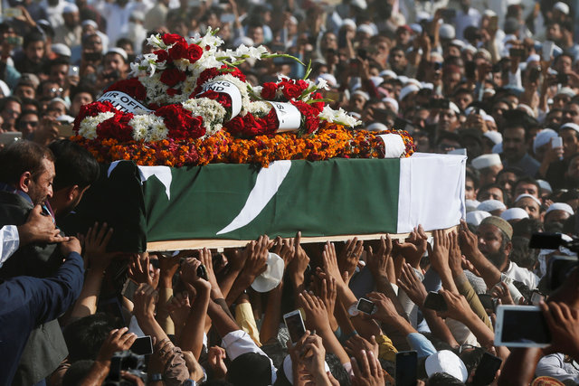 men carry the coffin of junaid jamshed wrapped in the national flag during his funeral in karachi december 15 2016 photo reuters