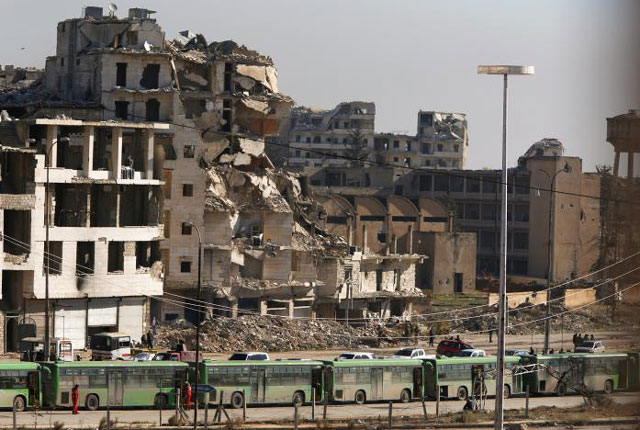 buses are seen parked in aleppo 039 s government controlled area of ramouseh as they wait to evacuate civilians and rebels from eastern aleppo syria december 15 2016 photo reuters