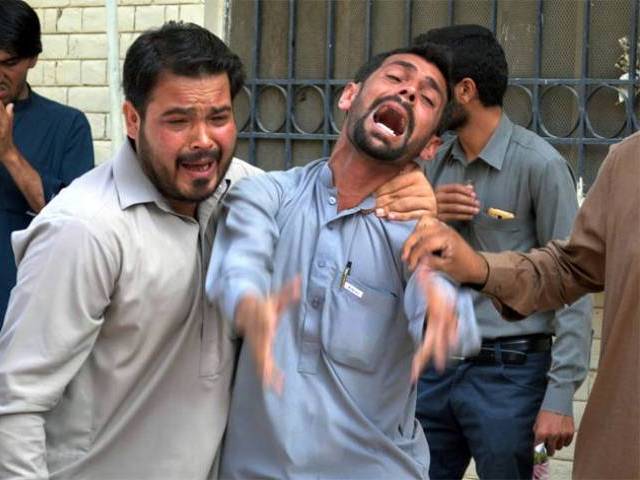 bystanders react at the site after a bomb explosion at civil hospital premises in quetta photo express tribune