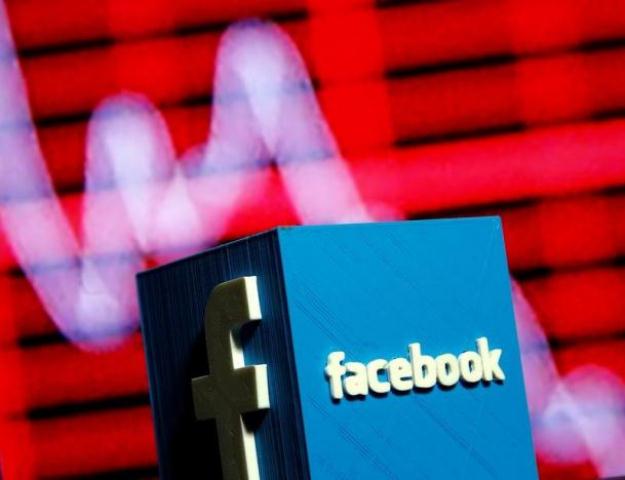 a 3d printed facebook logo is seen in front of a displayed stock graph in this illustration taken november 3 2016 photo reuters