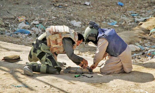 bomb disposal squad members defuse a suicide vest without wearing full protective gear in hyderabad photo online