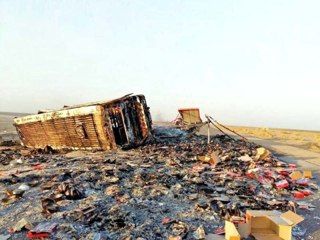 the burnt remains of the passenger bus that collided with a truck in chagai photo express the burnt remains of the passenger bus that collided with a truck in chagai photo express