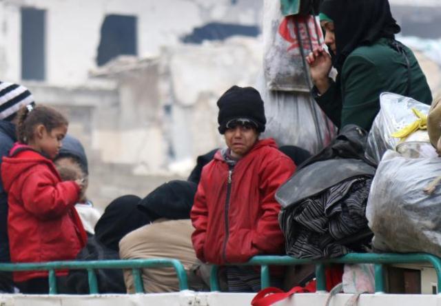 a child reacts while waiting with others to be evacuated from a rebel held sector of eastern aleppo syria december 16 2016 photo reuters