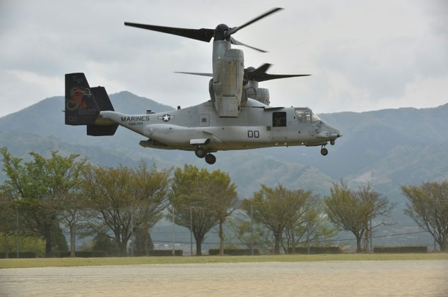 this photograph taken on april 18 2016 shows a us marine tilt rotor osprey aircraft landing at an emergency helicopter landing site in minami aso kumamoto prefecture photo afp