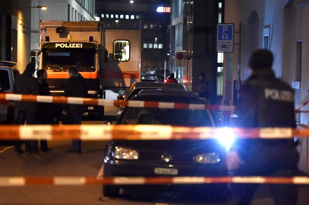 swiss police are seen behind a police cordon outside a muslim prayer hall central zurich on december 19 2016 phot afp