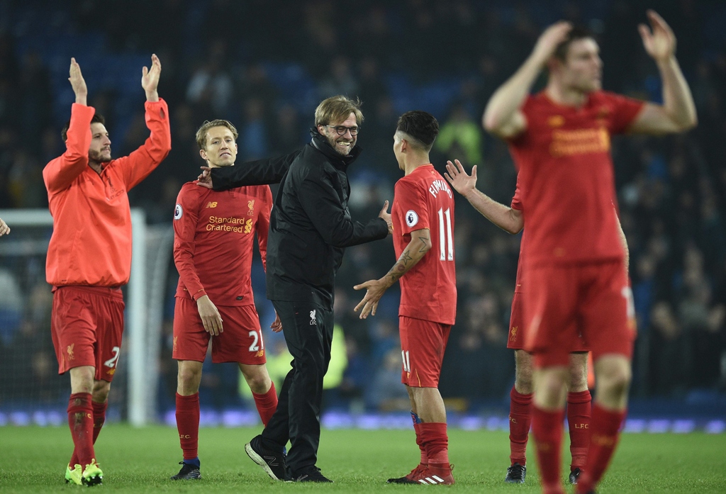 all smiles klopp has every reason to be happy after sadio mane struck a 94th minute winner for his side in a heated game against everton photo afp