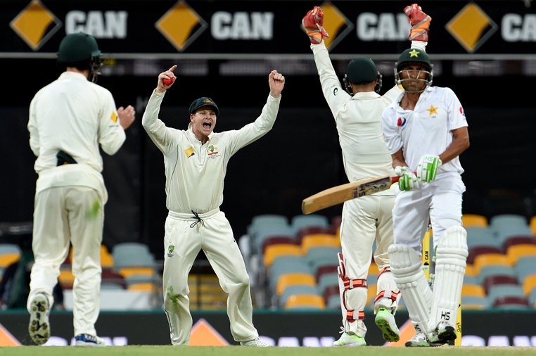 australia 039 s captain steven smith c celebrates his successful catch of pakistan 039 s batsman younus khan r off spin bowler nathan lyon and is caught behind by sten smith during the fourth day of the day night cricket test match between australia and pakistan in brisbane on december 18 2016 photo afp