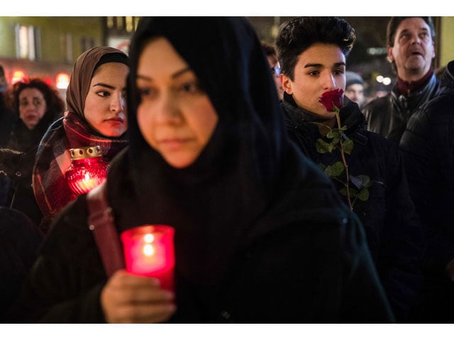 people mourn on december 20 2016 at a makeshift memorial in front of the kaiser wilhelm gedaechtniskirche kaiser wilhelm memorial church in berlin where a truck crashed the day before into a christmas market photo afp people mourn on december 20 2016 at a makeshift memorial in front of the kaiser wilhelm gedaechtniskirche kaiser wilhelm memorial church in berlin where a truck crashed the day before into a christmas market photo afp