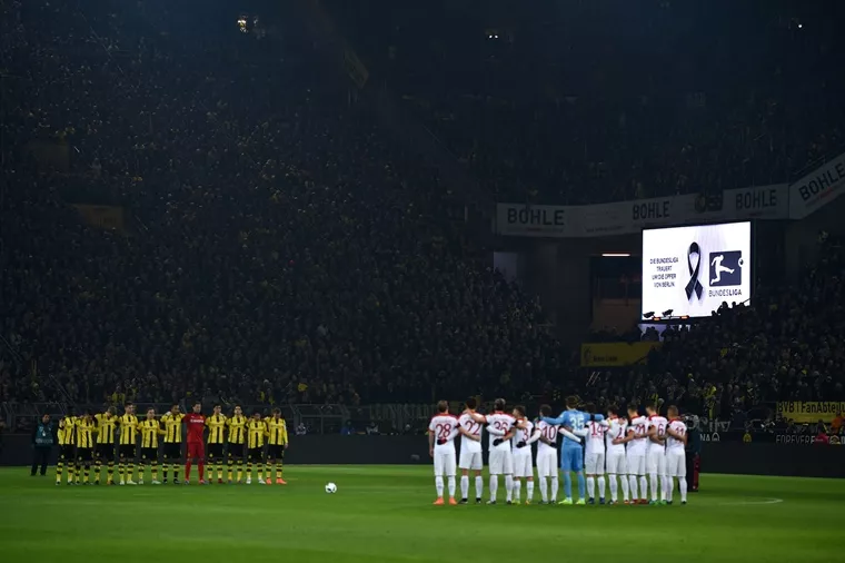 dortmund 039 s and augsburg 039 s players stand for a minute of silence for the victims of the berlin attack prior to the german first division bundesliga football match between borussia dortmund and fc augsburg in dortmund western germany on december 20 2016 photo afp dortmund 039 s and augsburg 039 s players stand for a minute of silence for the victims of the berlin attack prior to the german first division bundesliga football match between borussia dortmund and fc augsburg in dortmund western germany on december 20 2016 photo afp