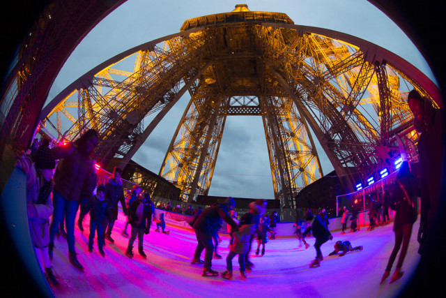 people enjoy skating at the open air christmas ice rink on the first floor of the eiffel tower after its reopening in paris photo afp